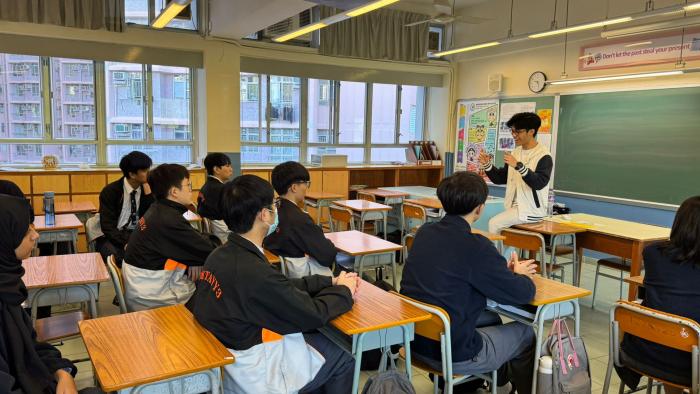 Volunteer sharing his views with secondary students