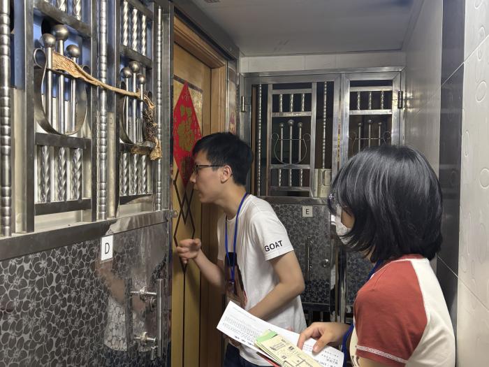 Volunteers conducting door-to-door visits in subdivided flats in the Sham Shui Po district