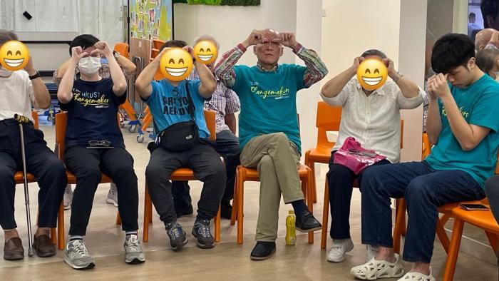 Volunteers playing games with the elderly