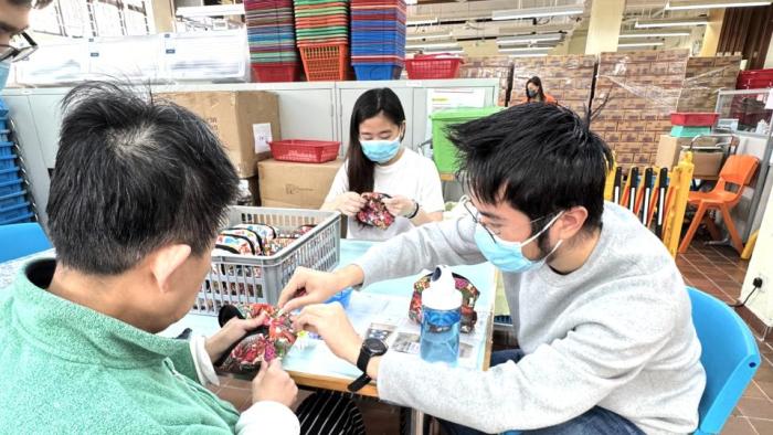 students making artwork with rehabilitated person