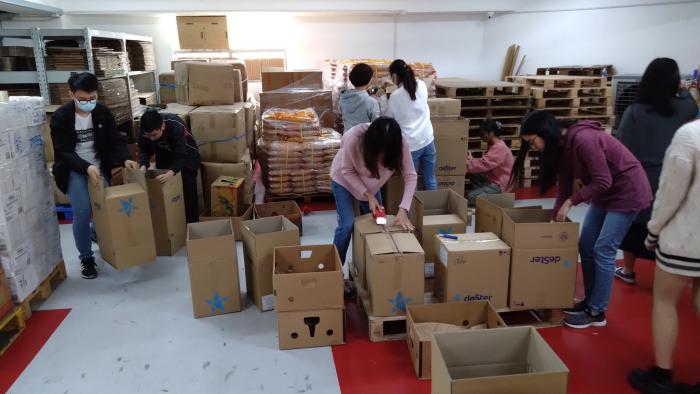 Volunteer is packing the food parcels
