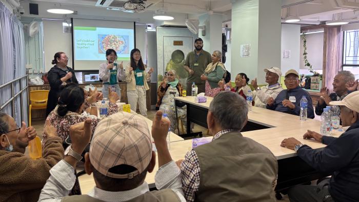 Students sharing healthier food choices with the elderly
