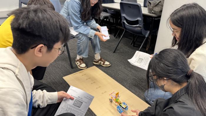 Secondary school students testing their tricycles