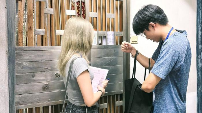 Volunteers visiting residents living in subdivided flats