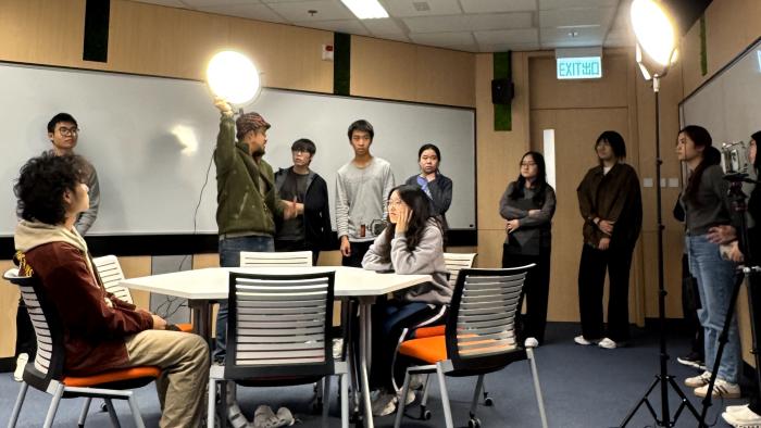 Participants learning how to properly set up lighting equipment