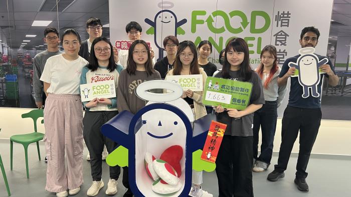 Proud smiles from our volunteers after successfully packing 1,663 meal boxes for those in need