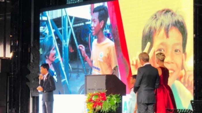 A child giving a speech on stage during CCF Gala
