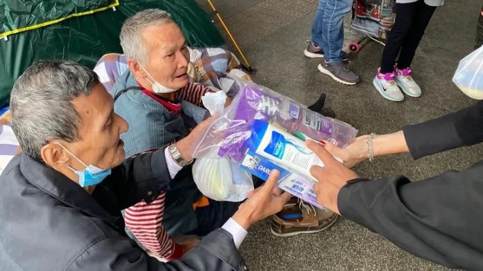 Volunteers delivering care packages to those in need.