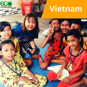 volunteer and kids smiling